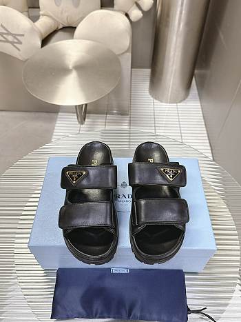Prada Nappa Leather Slides in Black Gold